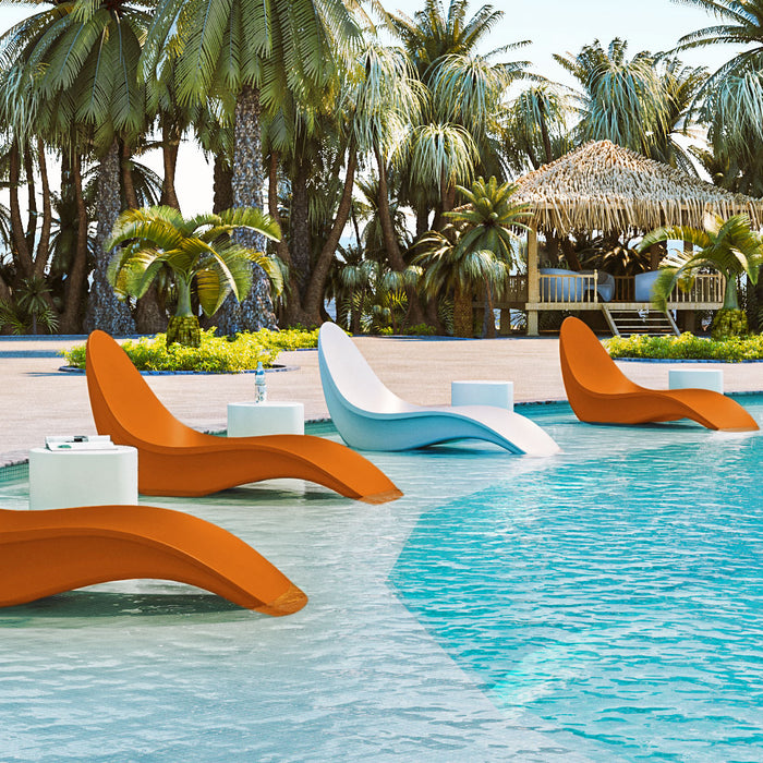 Bikini In-Pool Chaise Loungers line a commercial pool in alternating orange and white colors.