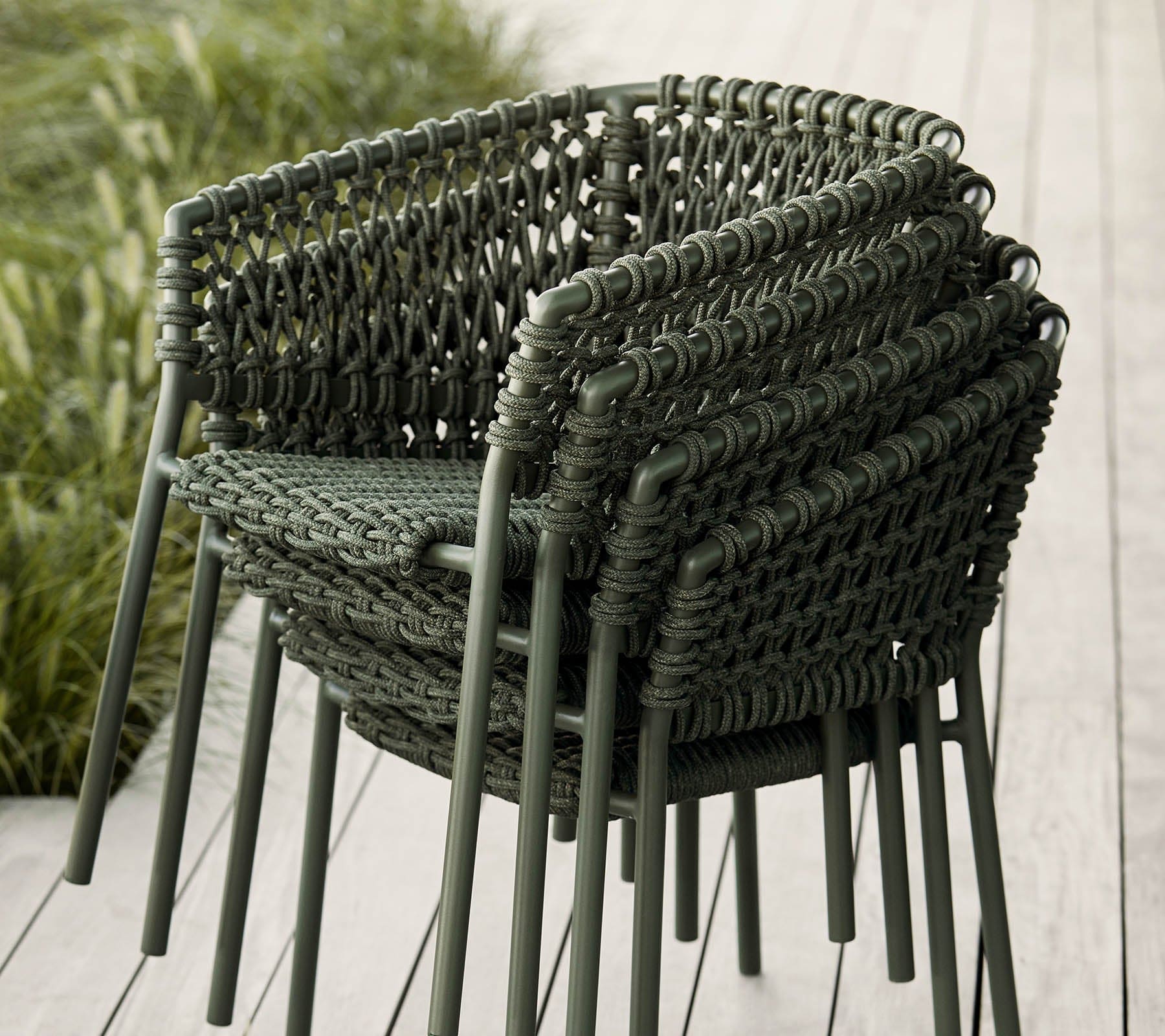 Boxhill's Ocean Outdoor Dining Armchair lifestyle image piled up