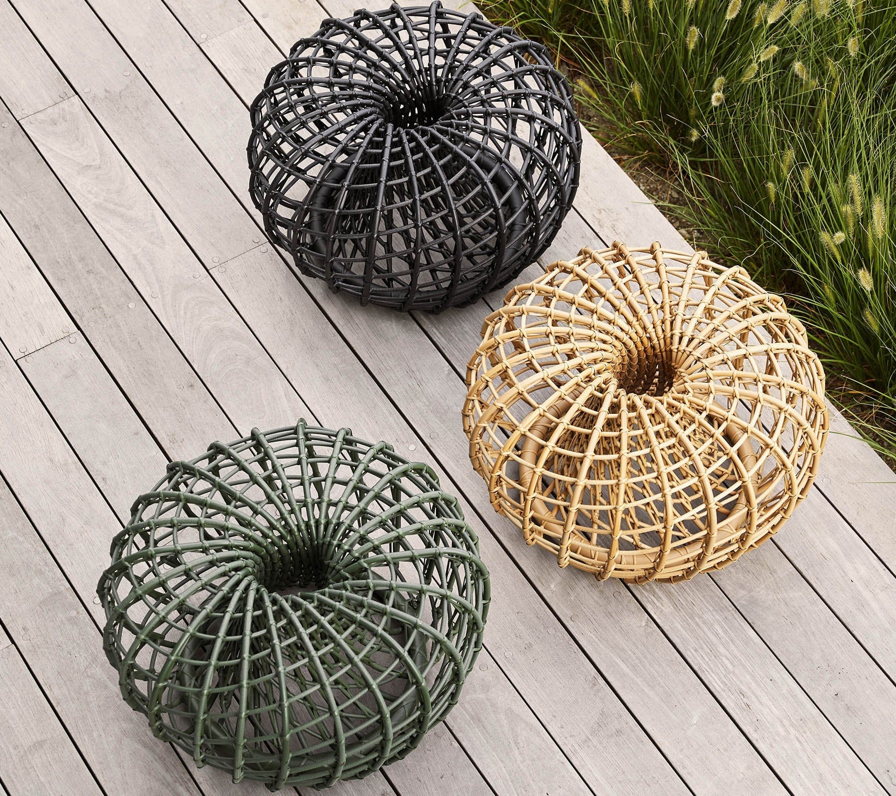 Boxhill's Nest Footstool/Coffee Table Outdoor lifestyle image on wooden platform, 3 different colors