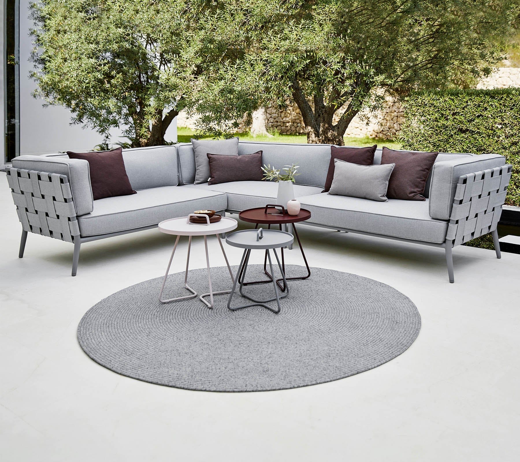 Boxhill's Conic Lounge Combo D Light Grey lifestyle image with Circle Outdoor Rug at patio