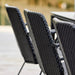 Boxhill's Vision black outdoor dining chair arranged in row beside dining table