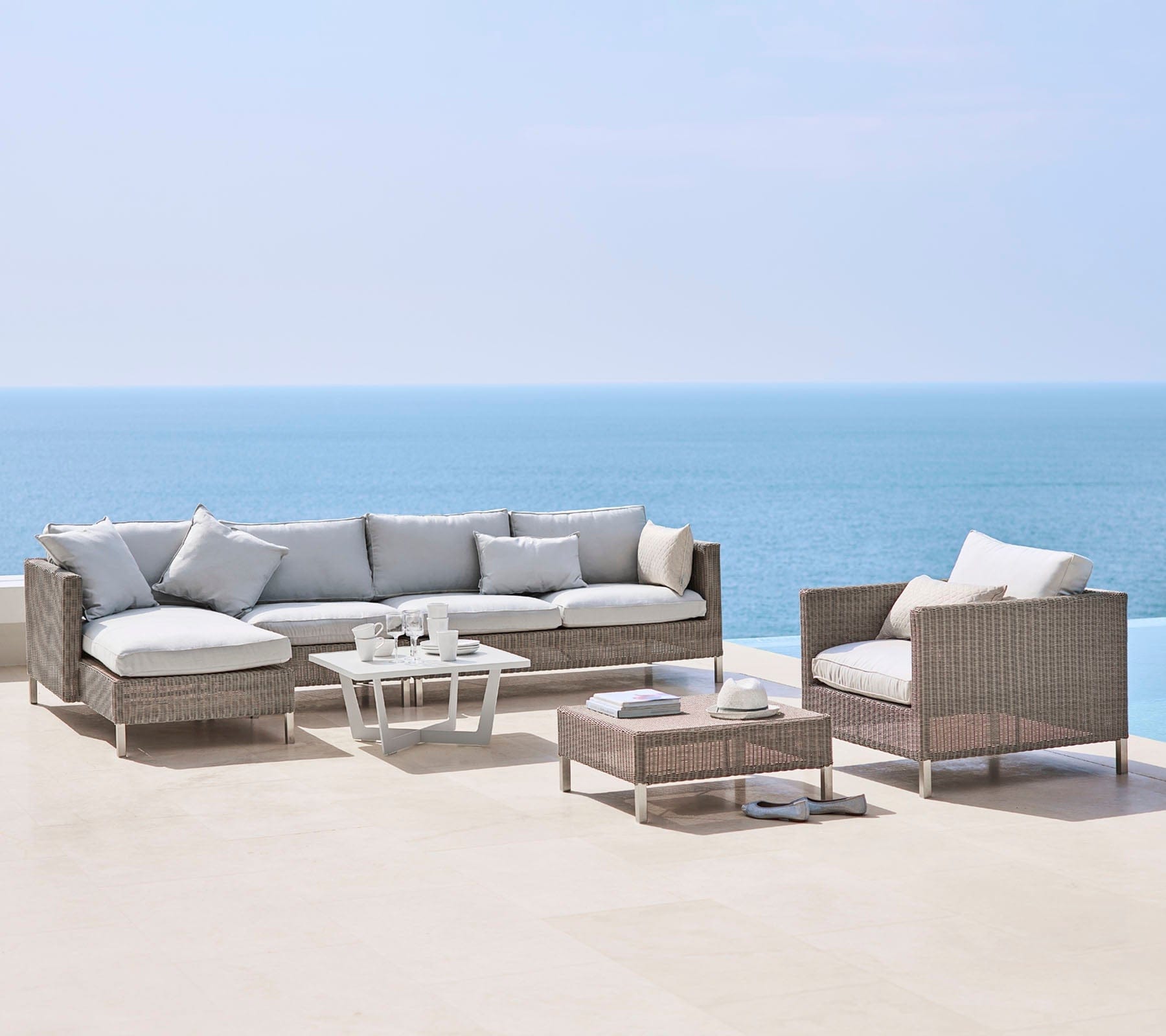 Boxhill's Connect Right Sectional Lounge Chair lifestyle image with other module sofa, Connect Lounge Chair and Connect Footstool beside the pool