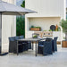 Boxhill's Diamond Terrace Weave Chair lifestyle image with a dining table and a parasol at patio