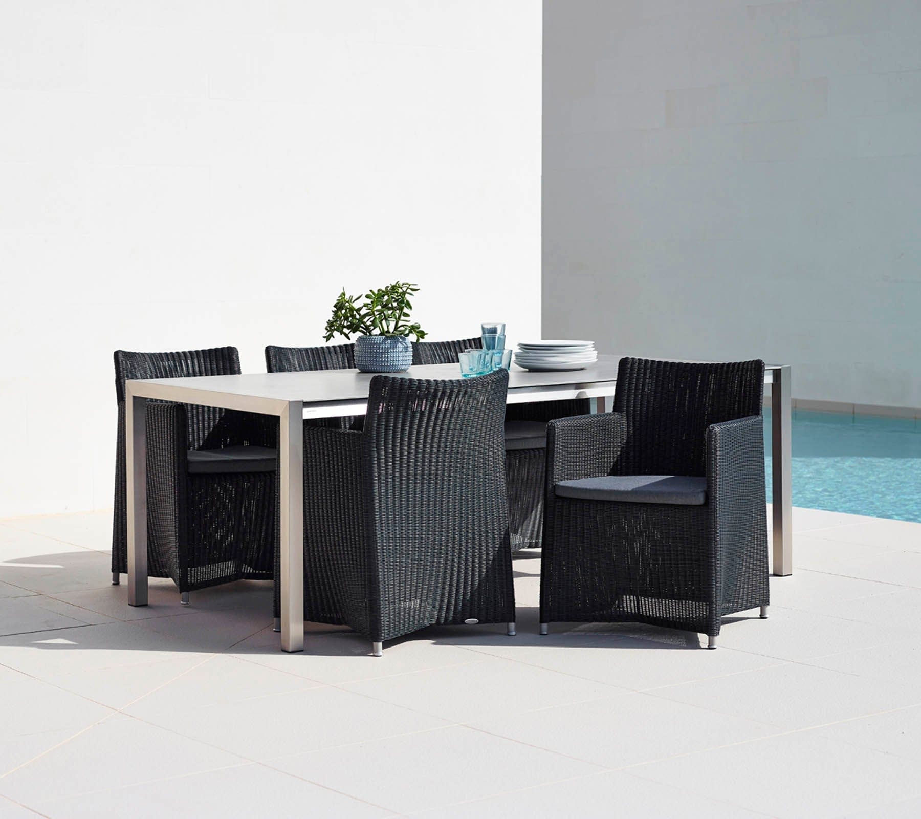 Boxhill's Diamond Terrace Weave Chair lifestyle image with a dining table beside the pool.