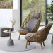 Boxhill's Hive Outdoor Lounge Chair lifestyle image with Hive Outdoor Highback Lounge chair and Glaze Outdoor Round Coffee Table