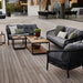 Boxhill's Ocean Large Outdoor 2-Seater Sofa lifestyle image with other Ocean Sofa and Chair Collection and Level Coffee Table with Teak Top 