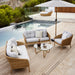 Boxhill's Ocean Large Outdoor Lounge Chair lifestyle image with other Ocean Sofa Collection beside the pool