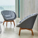 Boxhill's Peacock grey weave outdoor lounge chair with light grey outdoor round side table placed on balcony