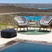  Boxhill's Peacock grey weave outdoor lounge chair with dark grey fabric footstool and white outdoor round side table 
