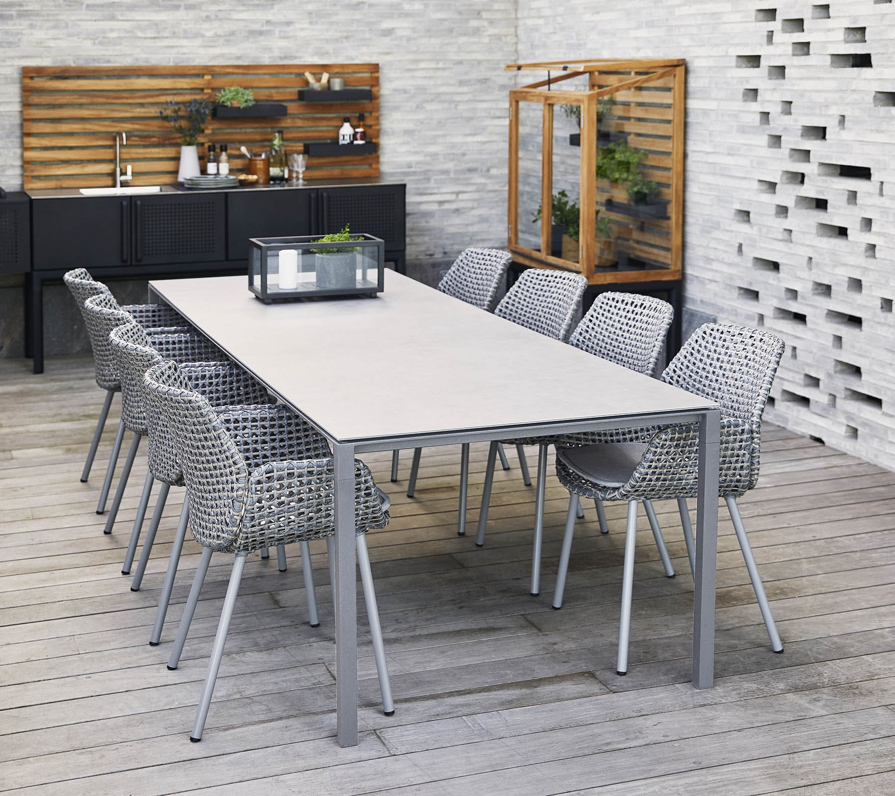 Boxhill's Pure light grey aluminum outdoor dining table with light grey outdoor dining chairs set on modern outdoor dining area