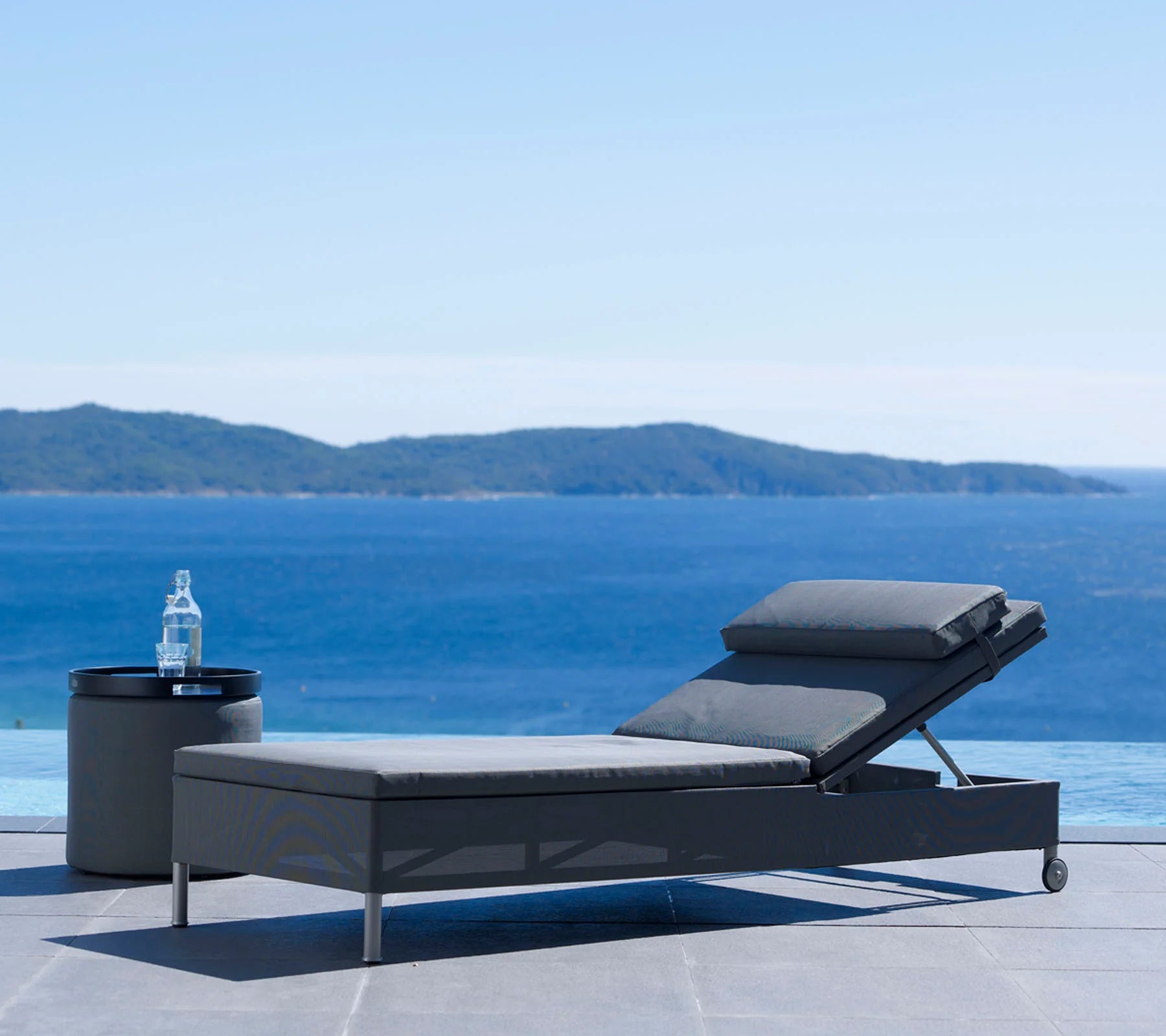  Boxhill's Rest grey outdoor chaise lounge | single sunbed with grey outdoor side table | footstool set beside the pool
