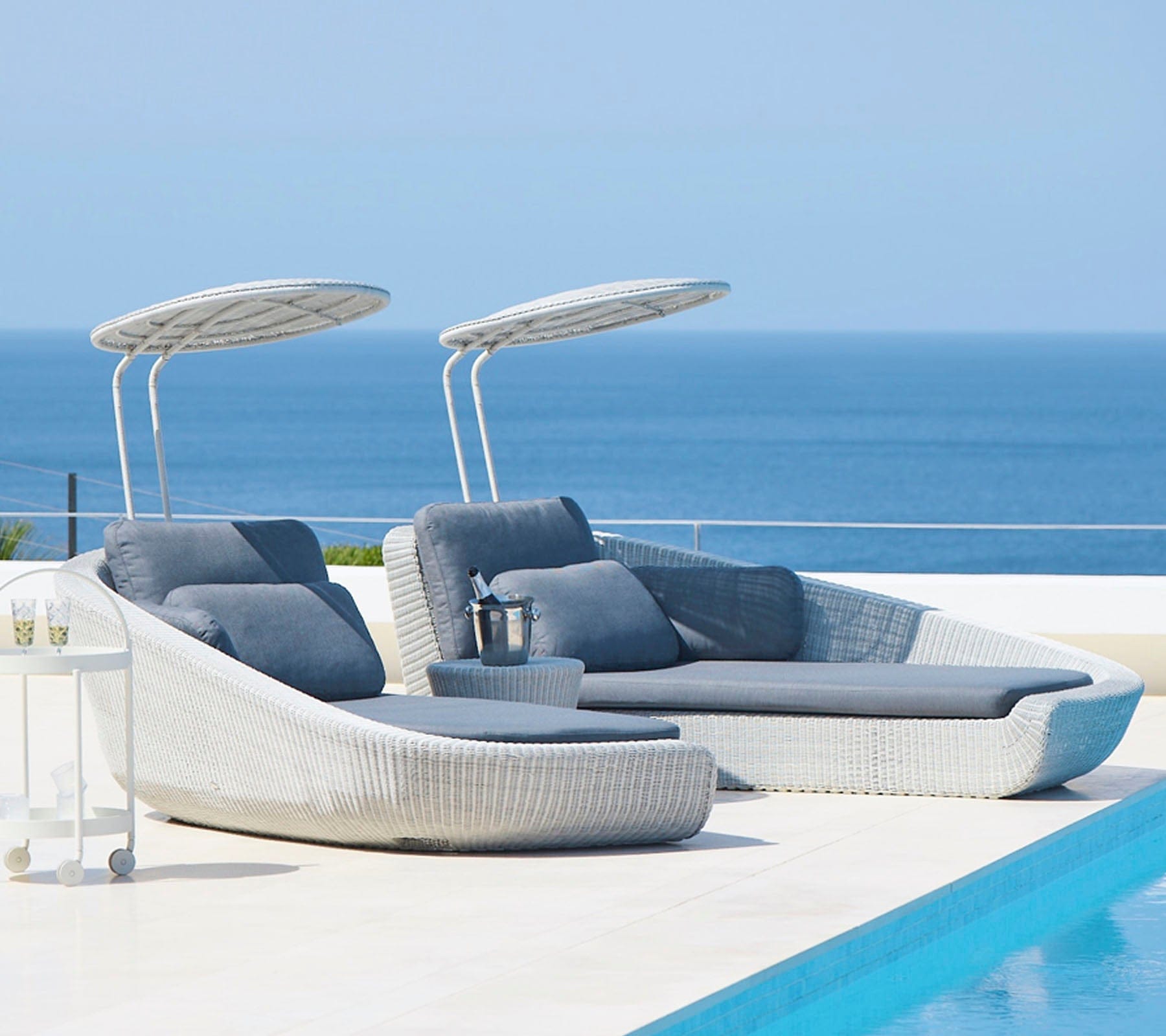 Boxhill's Savannah white grey outdoor sectional chaise lounge with shade with grey cushion set beside the pool