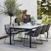 Boxhill's Vision black outdoor dining chair with dark grey cushion and dark grey outdoor dining table placed on balcony