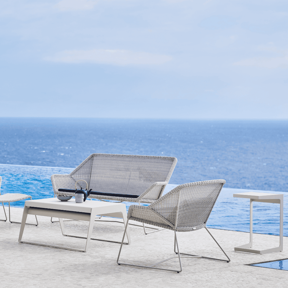 Boxhill's Breeze Outdoor Lounge Chair White Grey ifestyle image with Breeze 2-Seater Sofa beside the pool