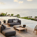 Boxhill's Capture Outdoor Coffee Table Lifestyle image with Capture Module Sofa beside the pool