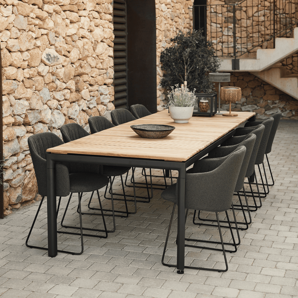 Boxhill's Choice Outdoor Dining Chair Warm Galvanized Steel Sledge Base lifestyle image with Pure Dining Table at patio