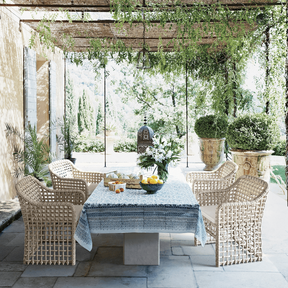 Boxhill's Kiawah Outdoor Dining Chair lifestyle image with Big Sur Dining Table at outdoor dining garden