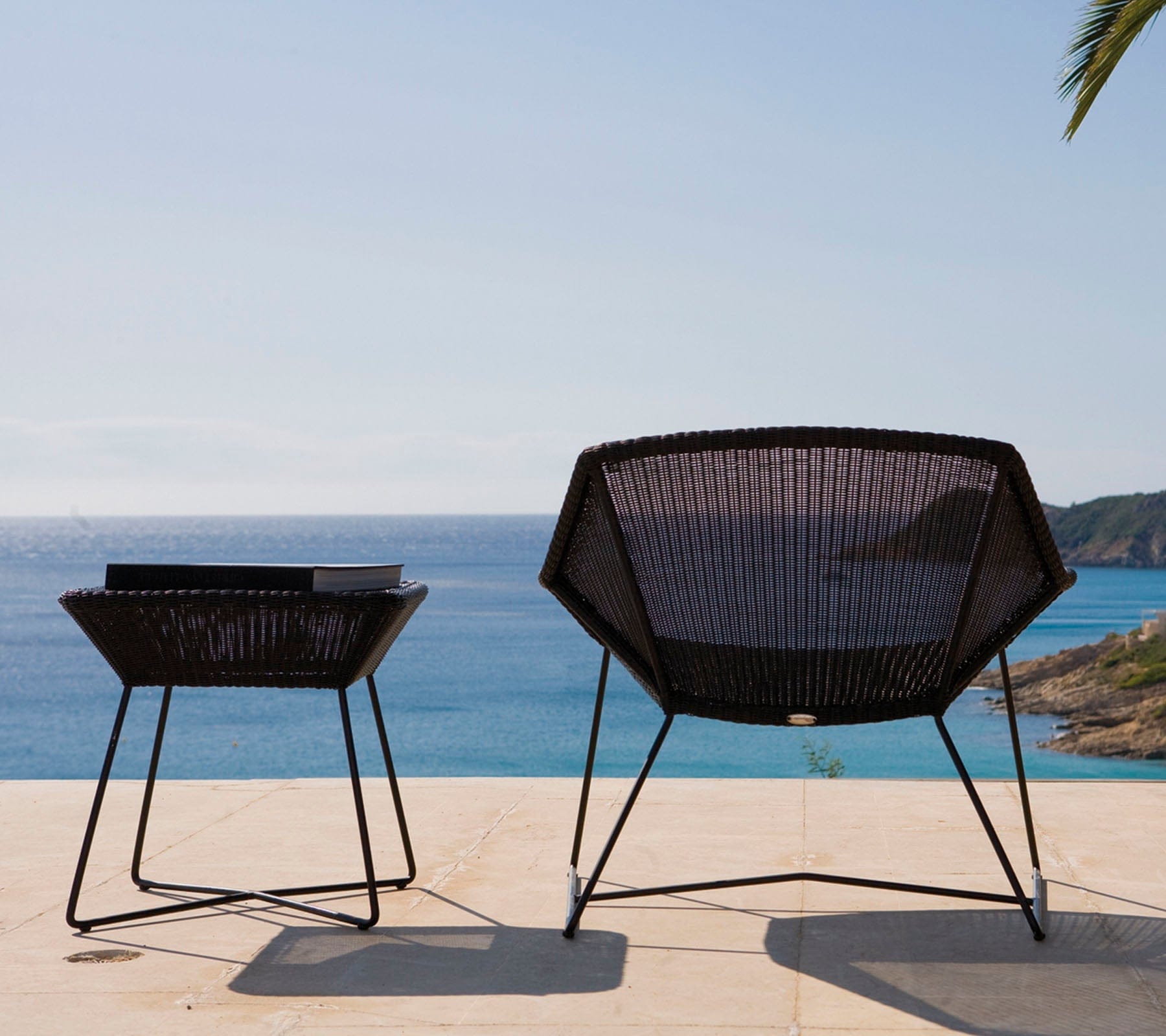 Boxhill's Breeze Outdoor Lounge Chair Black lifestyle image back view with Breeze Side Table