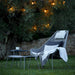 Boxhill's Breeze Highback Outdoor Chair Light Grey lifestyle image in the garden with cushion and pillow on it