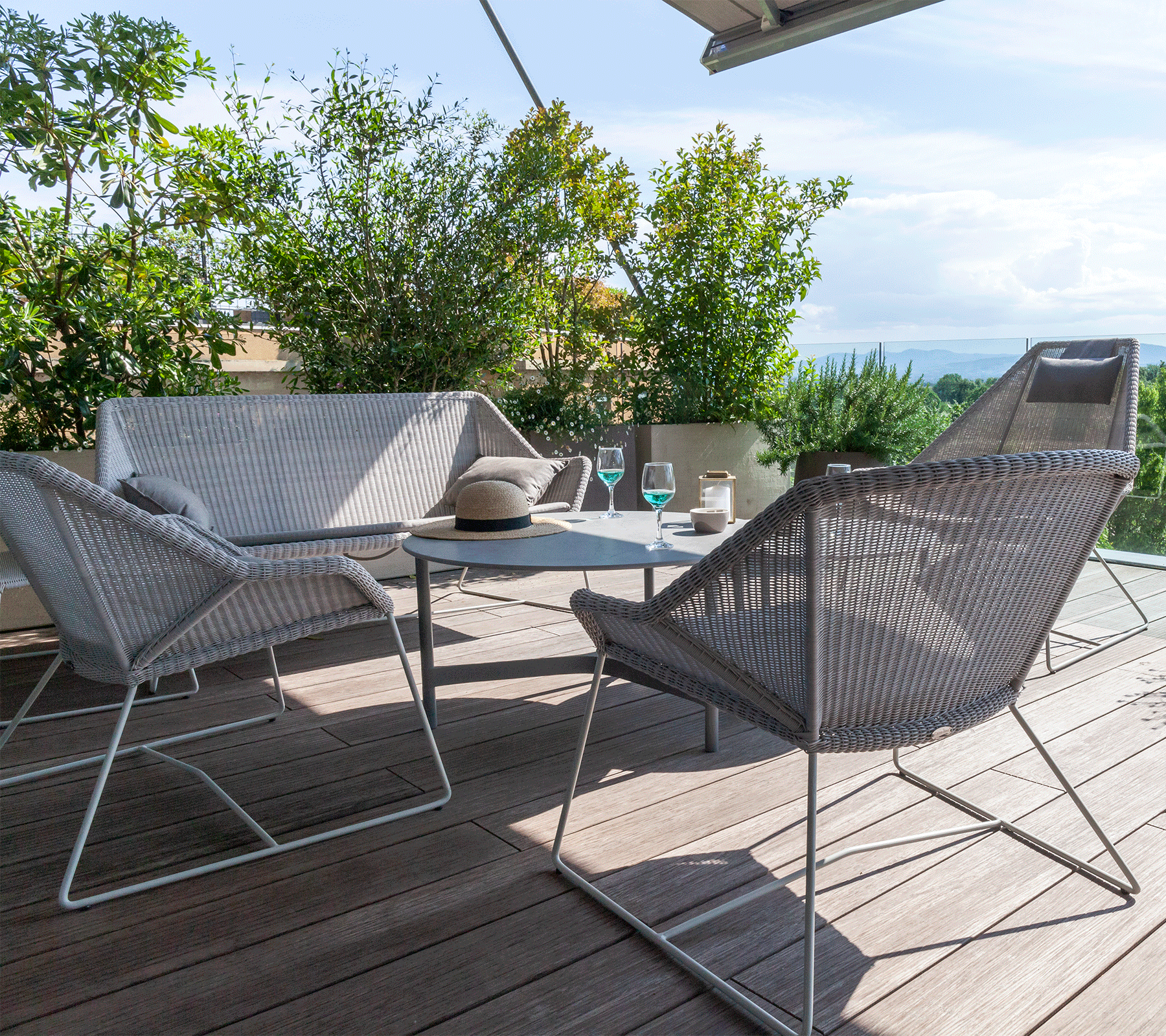 Boxhill's Breeze Outdoor Lounge Chair White Grey lifestyle image with Breeze 2-Seater Sofa ang Breeze Highback Chair
