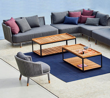 Boxhill's LEVEL Rectangle Coffee Table Lava Grey with Teak Table Top lifestyle image with sectional sofa beside the pool