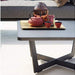 Boxhill's Time-Out brown outdoor small coffee table with tray, red pot and red cups on it