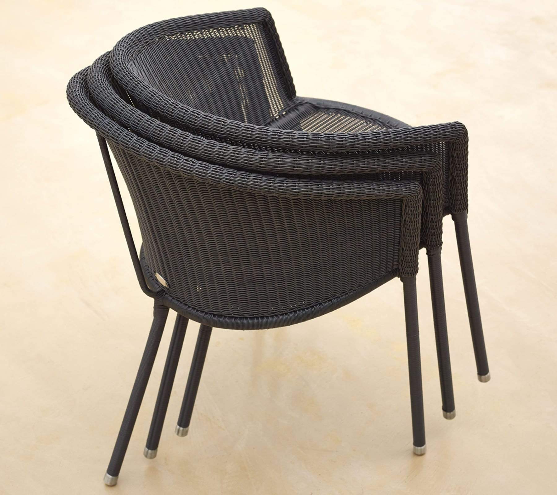  Boxhill's Trinity dark grey outdoor stackable chair piled up
