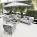 Boxhill's Conic Box Outdoor Storage Table lifestyle image in between Conic Module Sofa Light Grey with big umbrella sunshade at patio
