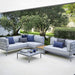 Boxhill's Conic Box Outdoor Storage Table lifestyle image in between Conic Module Sofa at patio
