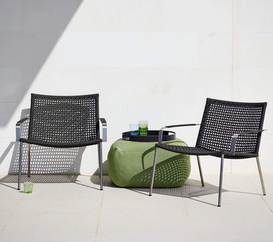 Boxhill's Straw dark grey outdoor lounge chair stainless steel frame with olive green footstool and black round trey on it