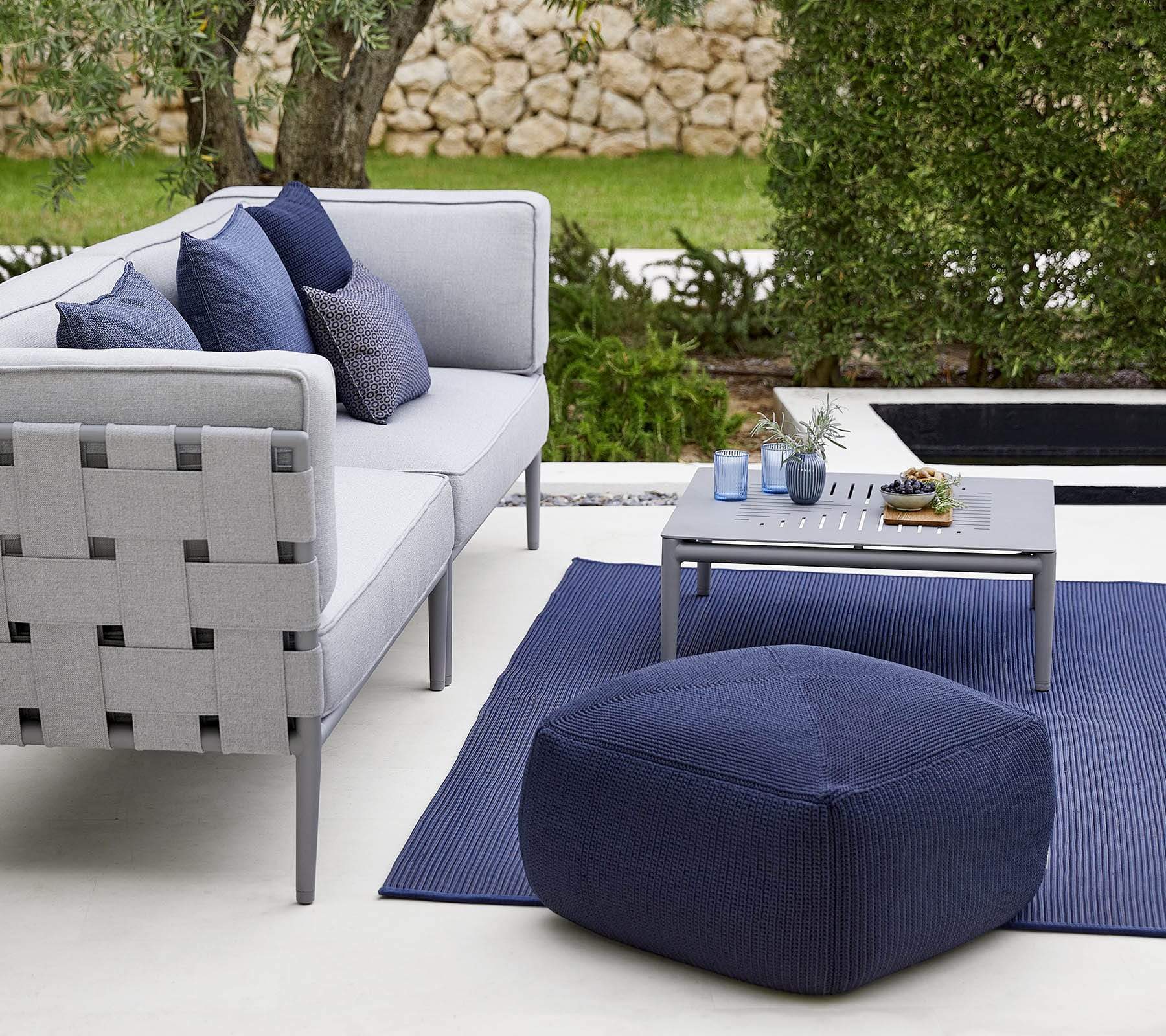 Boxhill's Divine Fabric Outdoor Footstool with 3-seater sofa and a small gray square table