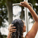 Boxhill's Lagoon Outdoor Shower lifestyle image with a woman taking a shower