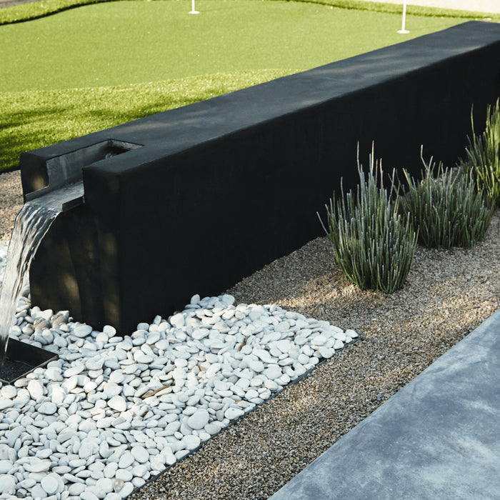 Boxhill design custom water feature in modern backyard garden.