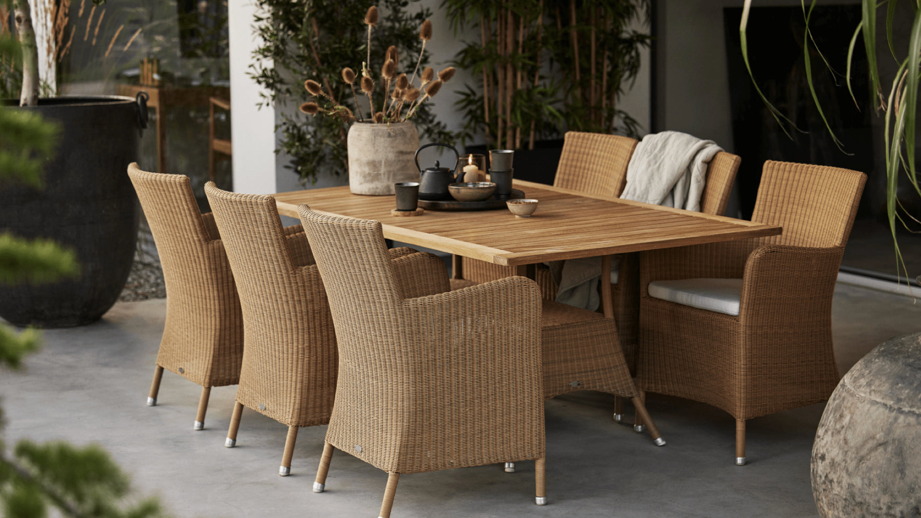 Boxhill's Hampsted Dining Chair and Lansing Dining Table make a cozy outdoor dining combination.