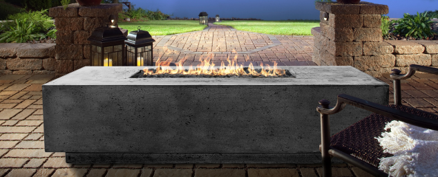 Boxhill's Pewter Tavola 1 Fire Pit Table near the lake.