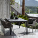 Boxhill's Ocean Outdoor Dining Armchair lifestyle image with dining table at patio