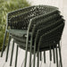 Boxhill's Ocean Outdoor Dining Armchair lifestyle image piled up