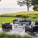 Boxhill's Connect 3-Seater Weave Sofa Graphite lifestyle image with Connect Lounge Chair on wooden platform at the garden