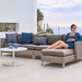 Boxhill's Connect Left Sectional Lounge Chair Taupe Cushion lifestyle image with other module sofa and a woman sitting down at patio