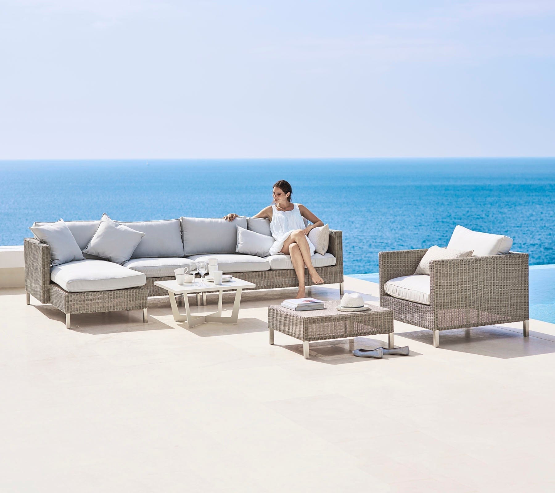 Boxhill's Connect 2-Seater Left Module Sofa lifestyle image with other Connect Module Sofa and Connect Lounge Chair with a woman sitting down