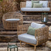 Boxhill's Nest Lounge Chair Lifestyle image with Nest 2-Seater Sofa, Nest Round Rattan Chair and Lighthouse Lantern on the stairs