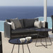 Boxhill's Diamond 2-Seater Weave Sofa lifestyle image with side table beside the pool