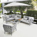 Boxhill's Conic Lounge Combo B Light Grey lifestyle image with Conic Lounge Chair, Conic Coffee Table and big umbrella sunshade at patio