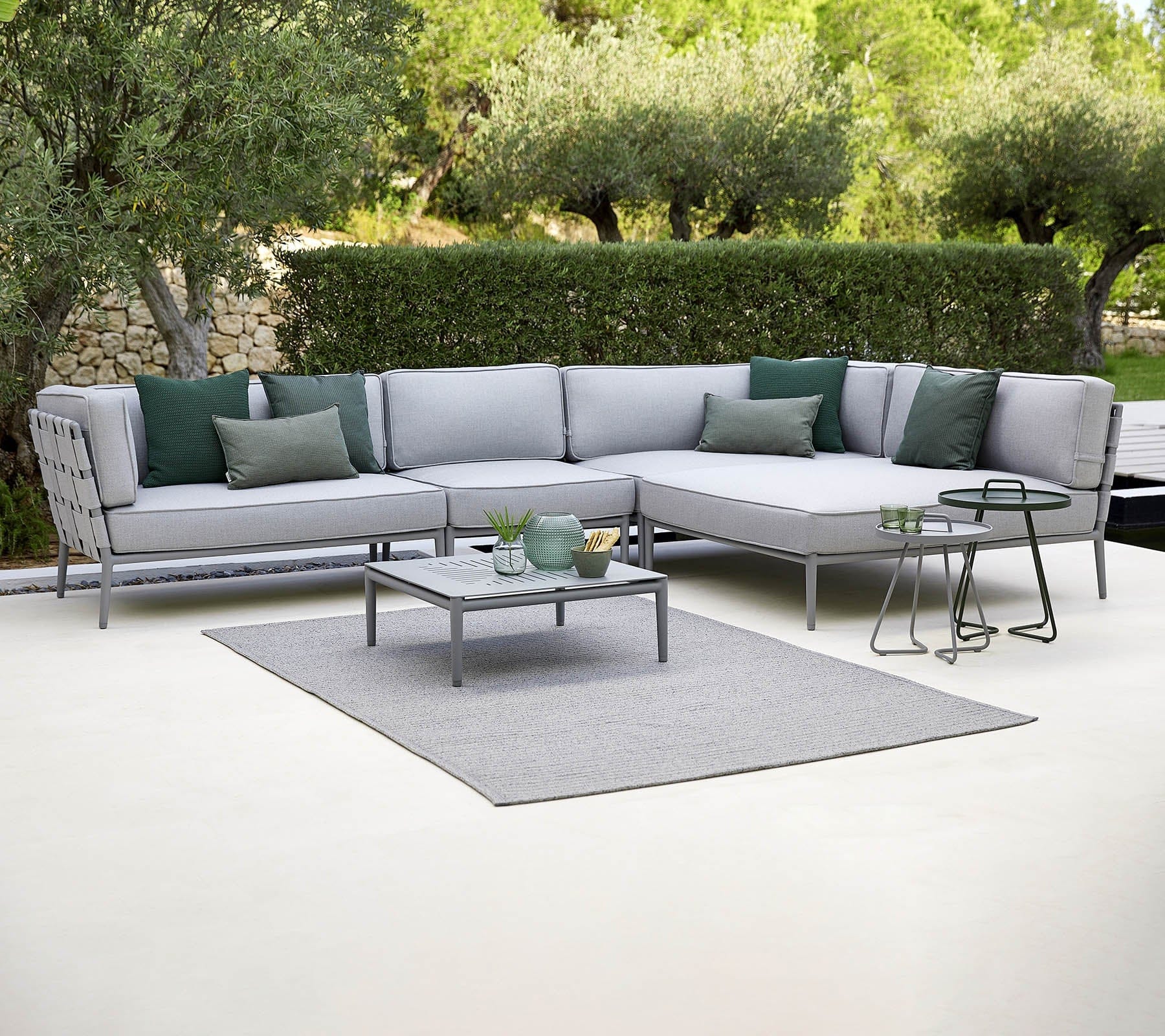 Boxhill's Conic Single Seater Sofa Module Light Grey lifestyle image with Conic Module Sofa and Conic Coffee Table at patio