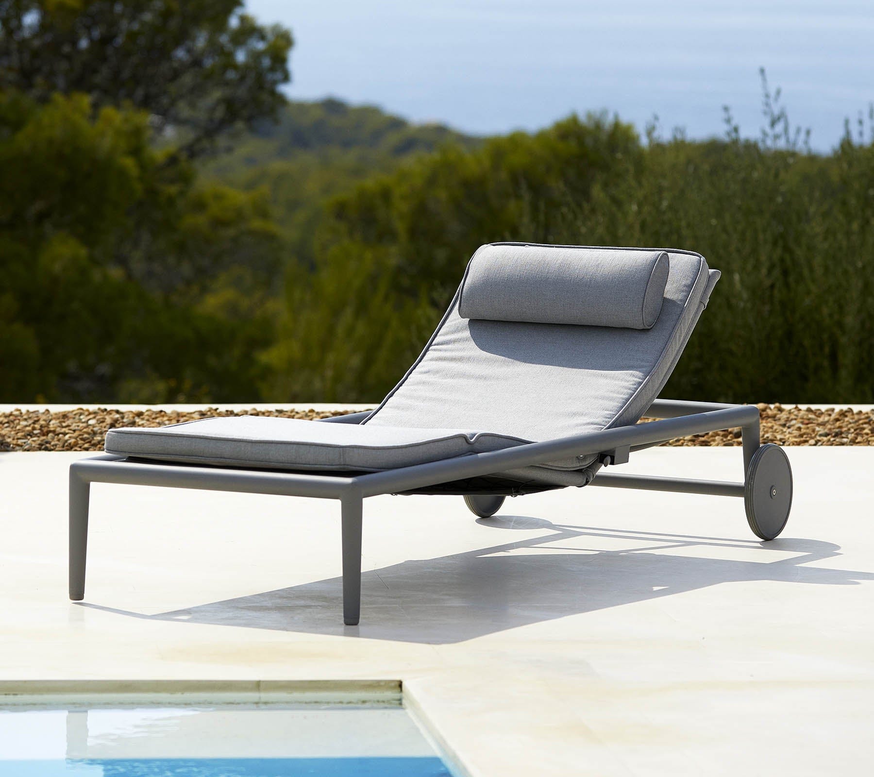Boxhill's Conic Rolling Chaise Lounge Sunbed Light Grey lifestyle image at poolside