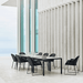 Boxhill's Breeze Dining Weave Chair Black lifestyle image around tables with plates and glass of water on top