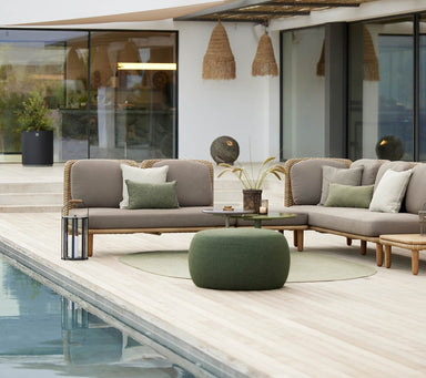Boxhill's Arch Outdoor Corner Sofa w/ Teak Coffee Table lifestyle image beside the pool