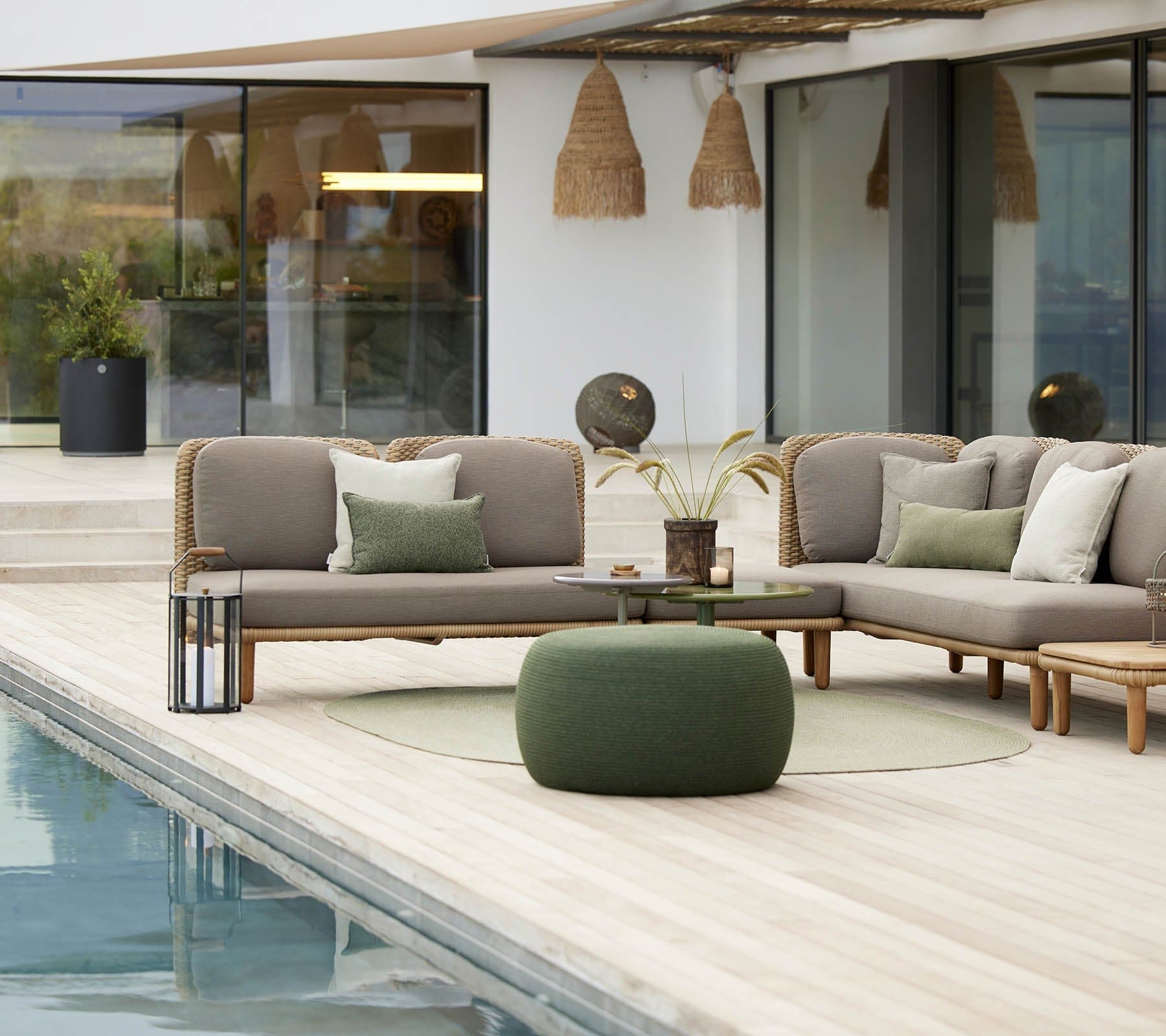 Boxhill's Arch Outdoor Back Cushion lifestyle image on Arch 2 Seater Sofa and Arch 3 Seater Sofa beside the pool