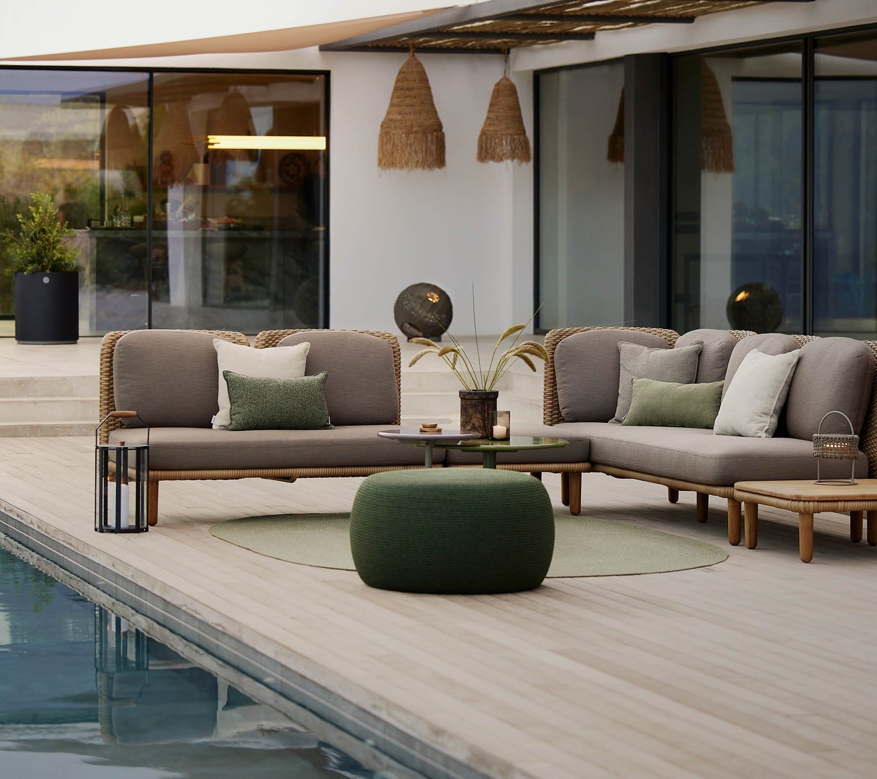 Boxhill's Arch Outdoor 2-Seater Module Sofa with Low Arm/Back and Back cushion lifestyle image beside the pool