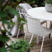 Boxhill's Area Outdoor Aluminum Dining Table White Lifestyle image on wooden platform